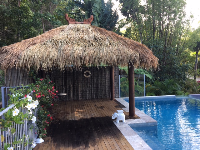 Custom Bali hut by a pool.