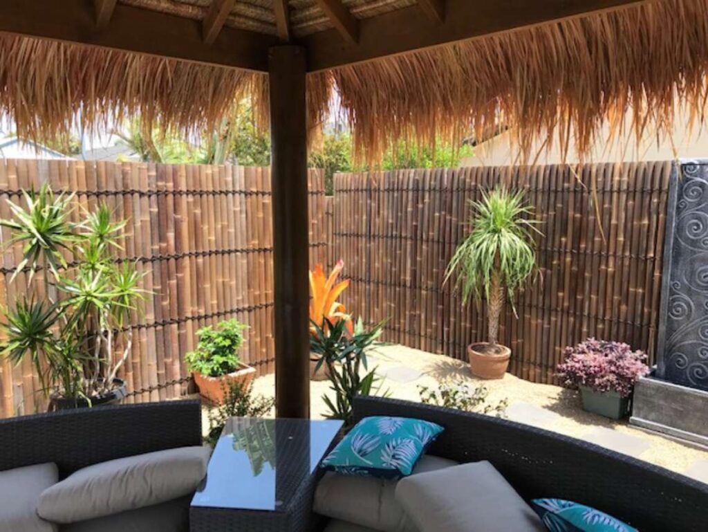 Bamboo screening around a bali hut